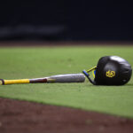 Aug 22, 2023; San Diego, California, USA; A detailed view of a San Diego Padres helmet and bat in the field during the seventh inning against the Miami Marlins at Petco Park. Mandatory Credit: Orlando Ramirez-USA TODAY Sports