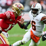49ers Browns Oct 15, 2023; Cleveland, Ohio, USA; San Francisco 49ers quarterback Brock Purdy (13) scrambles from Cleveland Browns linebacker Jeremiah Owusu-Koramoah (6) during the second half at Cleveland Browns Stadium. Mandatory Credit: Ken Blaze-USA TODAY Sports