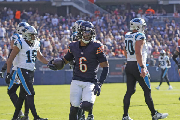 Oct 6, 2024; Chicago, Illinois, USA; Chicago Bears cornerback Kyler Gordon (6) recovers a fumble against the Carolina Panthers during the second half at Soldier Field. Mandatory Credit: David Banks-Imagn Images