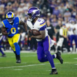 Jan 13, 2025; Glendale, AZ, USA; Minnesota Vikings running back Cam Akers (27) against the Los Angeles Rams during an NFC wild card game at State Farm Stadium. Mandatory Credit: Mark J. Rebilas-Imagn Images