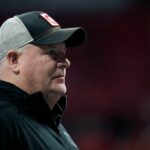 Raiders Ohio State offensive coordinator Chip Kelly watches warm ups before the start of the College Football Playoff National Championship at Mercedes-Benz Stadium in Atlanta on January 20, 2025.