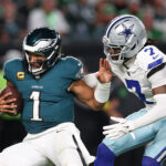 Eagles Cowboys onde assistir Sep 4, 2025; Philadelphia, Pennsylvania, USA; Dallas Cowboys cornerback Trevon Diggs (7) tackles Philadelphia Eagles quarterback Jalen Hurts (1) during the third quarter of the game at Lincoln Financial Field. Mandatory Credit: Bill Streicher-Imagn Images