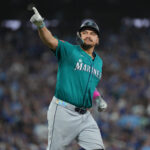 Oct 19, 2025; Toronto, Ontario, CAN; Seattle Mariners first baseman Josh Naylor (12) reacts after hitting a home run in the sixth inning against the Toronto Blue Jays during game six of the ALCS round for the 2025 MLB playoffs at Rogers Centre. Mandatory Credit: Nick Turchiaro-Imagn Images