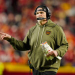 Oct 27, 2025; Kansas City, Missouri, USA; Washington Commanders head coach Dan Quinn reacts during the first half against the Kansas City Chiefs at GEHA Field at Arrowhead Stadium. Mandatory Credit: Jay Biggerstaff-Imagn Images