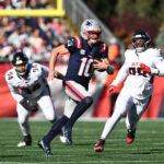 Nov 2, 2025; Foxborough, Massachusetts, USA; New England Patriots quarterback Drake Maye (10) scrambles with the ball against the Atlanta Falcons during the first quarter at Gillette Stadium. Mandatory Credit: Brian Fluharty-Imagn Images
