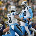 Nov 2, 2025; Green Bay, Wisconsin, USA; Carolina Panthers place kicker Ryan Fitzgerald (10) celebrates with punter Sam Martin (6) after kicking a game-winning field goal during the fourth quarter against the Green Bay Packers at Lambeau Field. Mandatory Credit: Jeff Hanisch-Imagn Images
