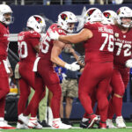 Nov 3, 2025; Arlington, Texas, USA; Arizona Cardinals tight end Trey McBride (85) celebrates with guard Will Hernandez (76) after scoring a touchdown against the Dallas Cowboys in the second half at AT&T Stadium. Mandatory Credit: Kevin Jairaj-Imagn Images