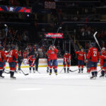 Nov 5, 2025; Washington, District of Columbia, USA; Washington Capitals left wing Alex Ovechkin (8) acknowledges the crowd as his teammates form a circle around him after their game against the St. Louis Blues, where he scored the 900th NHL goal, at Capital One Arena. Mandatory Credit: Geoff Burke-Imagn Images