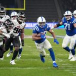 Nov 9, 2025; Berlin, Germany; Indianapolis Colts running back Jonathan Taylor (28) scores the winning touchdown in overtime against the Atlanta Falcons during the NFL Berlin Game at Olympic Stadium. Mandatory Credit: Kirby Lee-Imagn Images