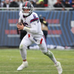 Nov 9, 2025; Chicago, Illinois, USA; New York Giants quarterback Jaxson Dart (6) rushes the ball against the Chicago Bears during the second half at Soldier Field. Mandatory Credit: Mike Dinovo-Imagn Images