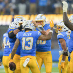 Nov 9, 2025; Inglewood, California, USA; Los Angeles Chargers wide receiver Keenan Allen (13) celebrates with teammates after a reception against the Pittsburgh Steelers during the fourth quarter of the game at SoFi Stadium. Allen set a franchise record for reception with this catch. Mandatory Credit: Jayne Kamin-Oncea-Imagn Images