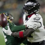 Green Bay Packers cornerback Carrington Valentine (24) breaks up a pass intended for Philadelphia Eagles wide receiver A.J. Brown (11) during the fourth quarter of their game Monday, November 10, 2025 at Lambeau Field in Green Bay, Wisconsin.