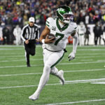 Nov 13, 2025; Foxborough, Massachusetts, USA; New York Jets quarterback Justin Fields (7) runs the ball for a touchdown during the first half against the New England Patriots at Gillette Stadium. Mandatory Credit: Eric Canha-Imagn Images