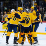 Nov 14, 2025; Stockholm, SWEDEN; Nashville Predators goaltender Juuse Saros (74) and teammates celebrate defeating the Pittsburgh Penguins in overtime in a Global Series ice hockey game at Avicii Arena. Mandatory Credit: Per Haljestam-Imagn Images