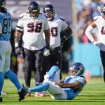 Tennessee Titans wide receiver Calvin Ridley (0) grabs his leg after the Titans offense’s first play of the game during the first quarter against the Houston Texans at Nissan Stadium in Nashville, Tenn., Sunday, Nov. 16, 2025.