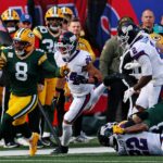Nov 16, 2025; East Rutherford, New Jersey, USA; Green Bay Packers running back Josh Jacobs (8) runs the ball against New York Giants safety Dane Belton (24) during the first quarter at MetLife Stadium. Mandatory Credit: Vincent Carchietta-Imagn Images
