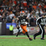 Nov 16, 2025; Cleveland, Ohio, USA; Cleveland Browns quarterback Shedeur Sanders (12) runs for a gain during the fourth quarter against the Baltimore Ravens at Huntington Bank Field. Mandatory Credit: Scott Galvin-Imagn Images