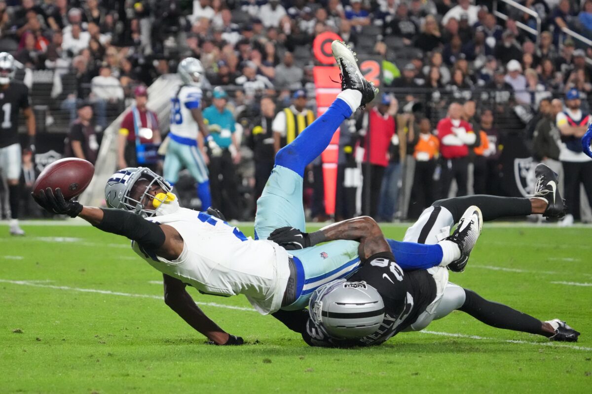 Nov 17, 2025; Paradise, Nevada, USA; Dallas Cowboys wide receiver George Pickens (3) reaches for extra yardage as he is tackled by Las Vegas Raiders cornerback Kyu Blu Kelly (36) during the second half at Allegiant Stadium. Mandatory Credit: Kirby Lee-Imagn Images