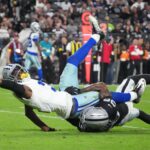 Nov 17, 2025; Paradise, Nevada, USA; Dallas Cowboys wide receiver George Pickens (3) reaches for extra yardage as he is tackled by Las Vegas Raiders cornerback Kyu Blu Kelly (36) during the second half at Allegiant Stadium. Mandatory Credit: Kirby Lee-Imagn Images