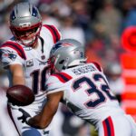 Patriots Giants New England Patriots quarterback Drake Maye (10) hands off to running back TreVeyon Henderson (32) in the first quarter of the NFL Week 12 game between the Cincinnati Bengals and the New England Patriots at Paycor Stadium in downtown Cincinnati on Sunday, Nov. 23, 2025.