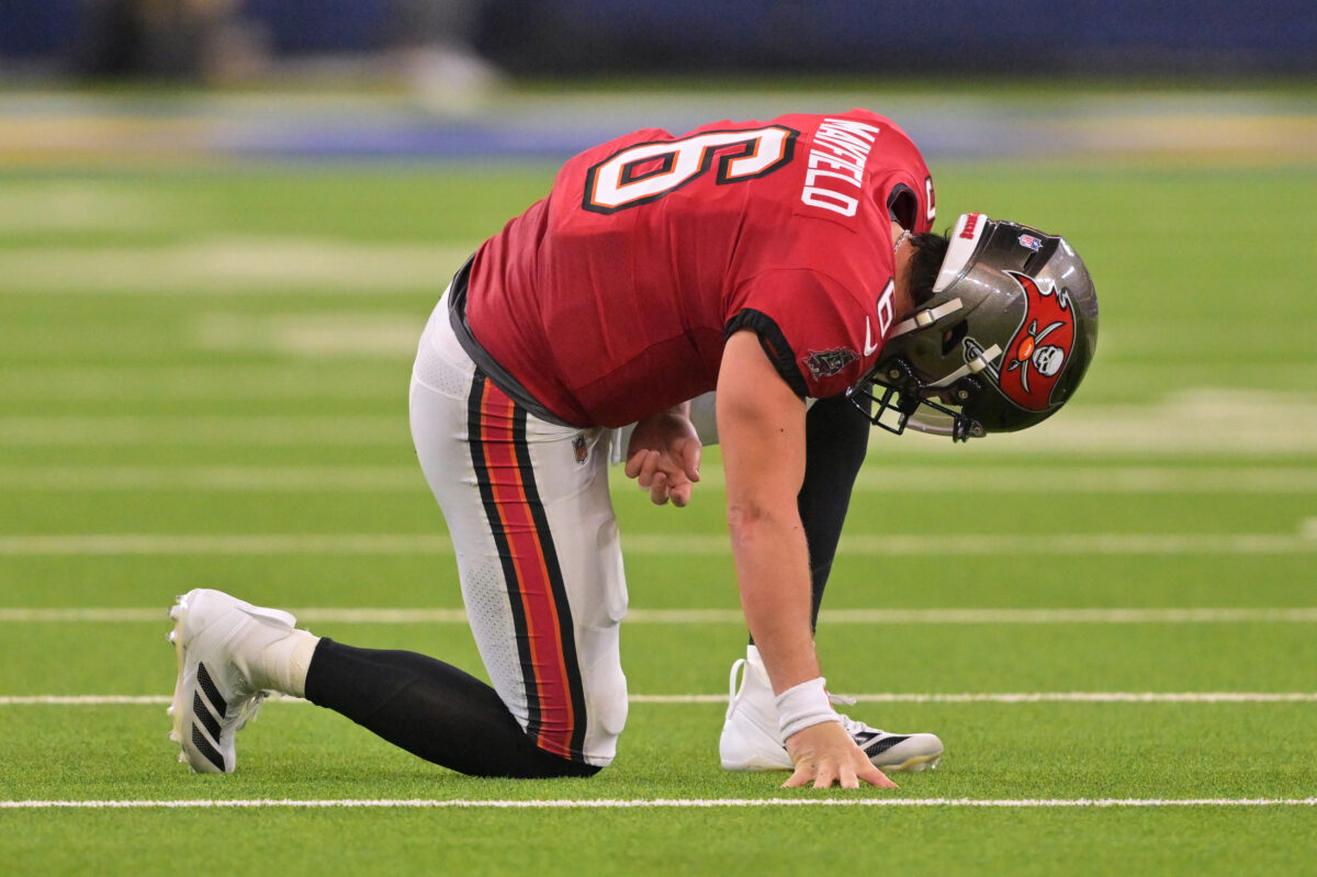Nov 23, 2025; Inglewood, California, USA; Tampa Bay Buccaneers quarterback Baker Mayfield (6) kneels on the field with an apparent injury against the Los Angeles Rams during the second quarter at SoFi Stadium. Mandatory Credit: Jayne Kamin-Oncea-Imagn Images