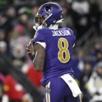 Nov 27, 2025; Baltimore, Maryland, USA; Baltimore Ravens quarterback Lamar Jackson (8) drops back to pass against the Cincinnati Bengals during the first half at M&T Bank Stadium. Mandatory Credit: Tommy Gilligan-Imagn Images