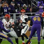 Bengals Joe Burrow (9) looks for a pass during their game against the Ravens at M&T Bank Stadium on Thanksgiving Thursday November 27, 2025.