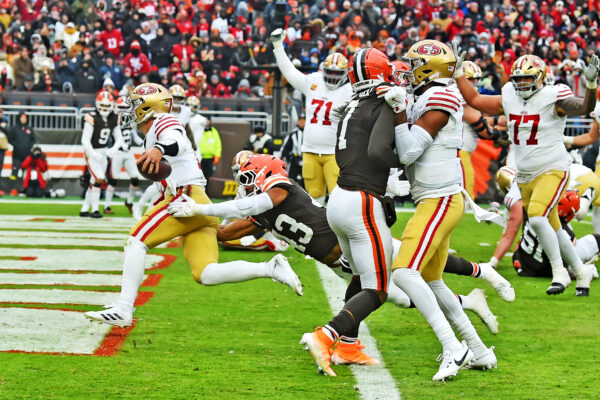 Nov 30, 2025; Cleveland, Ohio, USA; San Francisco 49ers quarterback Brock Purdy (13) scores a touchdown during the second half against the Cleveland Browns at Huntington Bank Field. Mandatory Credit: Ken Blaze-Imagn Images