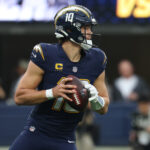 Nov 30, 2025; Inglewood, California, USA; Los Angeles Chargers quarterback Justin Herbert (10) drops back to pass against the Las Vegas Raiders during the second half at SoFi Stadium. Mandatory Credit: Kiyoshi Mio-Imagn Images
