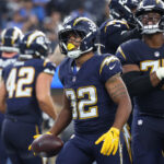 Chargers Raiders Nov 30, 2025; Inglewood, California, USA; Los Angeles Chargers running back Jaret Patterson (32) reacts after scoring a touchdown against the Las Vegas Raiders during the second half at SoFi Stadium. Mandatory Credit: Kiyoshi Mio-Imagn Images