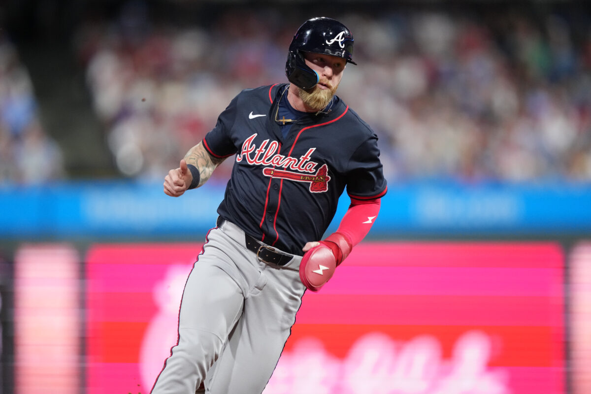 Aug 30, 2025; Philadelphia, Pennsylvania, USA; Atlanta Braves outfielder Jake Fraley (16) advances home to score against the Philadelphia Phillies in the tenth inning at Citizens Bank Park.
