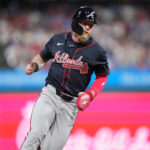 Aug 30, 2025; Philadelphia, Pennsylvania, USA; Atlanta Braves outfielder Jake Fraley (16) advances home to score against the Philadelphia Phillies in the tenth inning at Citizens Bank Park.