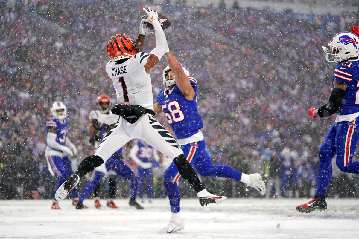 Bengals Bills Cincinnati Bengals wide receiver Ja'Marr Chase (1) leaps fo a catch in the zone as Buffalo Bills linebacker Matt Milano (58) defends in the second quarter during an NFL divisional playoff football game between the Cincinnati Bengals and the Buffalo Bills, Sunday, Jan. 22, 2023, at Highmark Stadium in Orchard Park, N.Y. The catch was ruled incomplete upon further review.