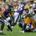 Green Bay Packers running back Emanuel Wilson (31) runs the ball against the Baltimore Ravens during an NFL preseason game on Saturday, August 24, 2024, at Lambeau Field in Green Bay, Wis.
