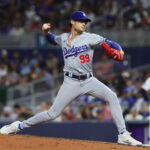 Sep 18, 2024; Miami, Florida, USA; Los Angeles Dodgers relief pitcher Joe Kelly (99) delivers a pitch against the Miami Marlins during the sixth inning at loanDepot Park. Mandatory Credit: Sam Navarro-Imagn Images