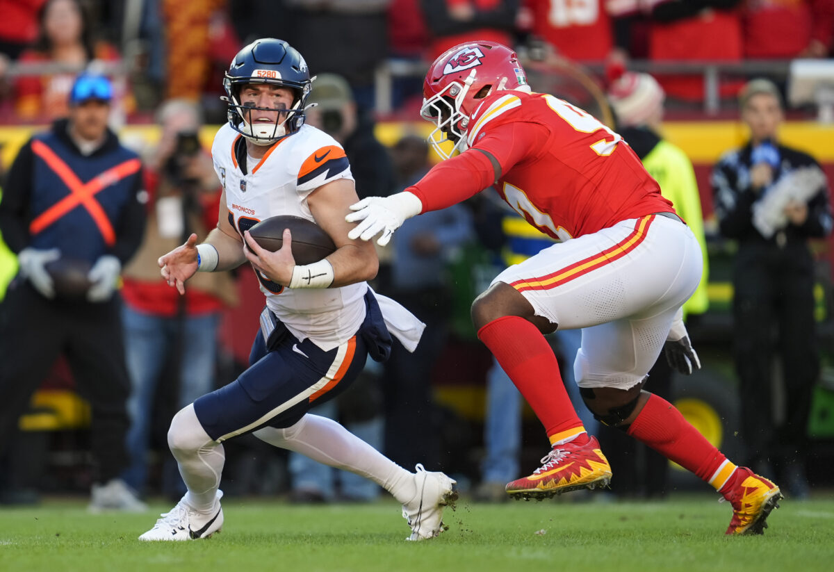 Nov 10, 2024; Kansas City, Missouri, USA; Denver Broncos quarterback Bo Nix (10) is sacked by Kansas City Chiefs defensive end Felix Anudike-Uzomah (97) at GEHA Field at Arrowhead Stadium. Mandatory Credit: Jay Biggerstaff-Imagn Images