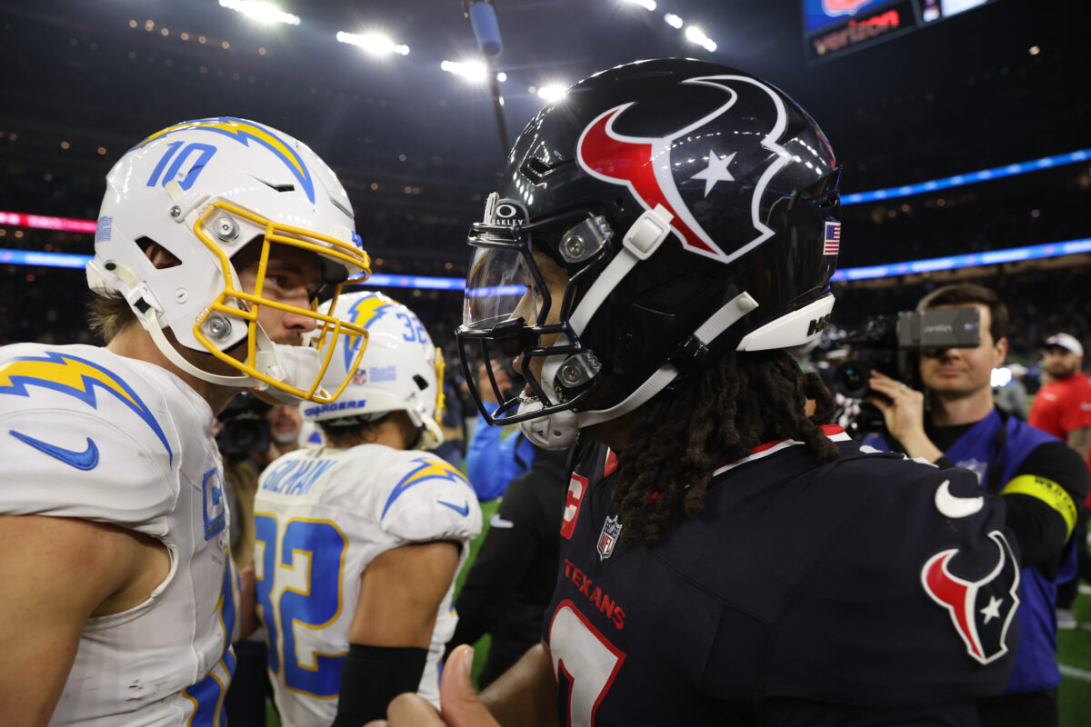 Jan 11, 2025; Houston, Texas, USA; Houston Texans quarterback C.J. Stroud (7) and Los Angeles Chargers quarterback Justin Herbert (10) after defeating the Los Angeles Chargers in an AFC wild card game at NRG Stadium. Mandatory Credit: Thomas Shea-Imagn Images