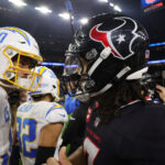 Jan 11, 2025; Houston, Texas, USA; Houston Texans quarterback C.J. Stroud (7) and Los Angeles Chargers quarterback Justin Herbert (10) after defeating the Los Angeles Chargers in an AFC wild card game at NRG Stadium. Mandatory Credit: Thomas Shea-Imagn Images