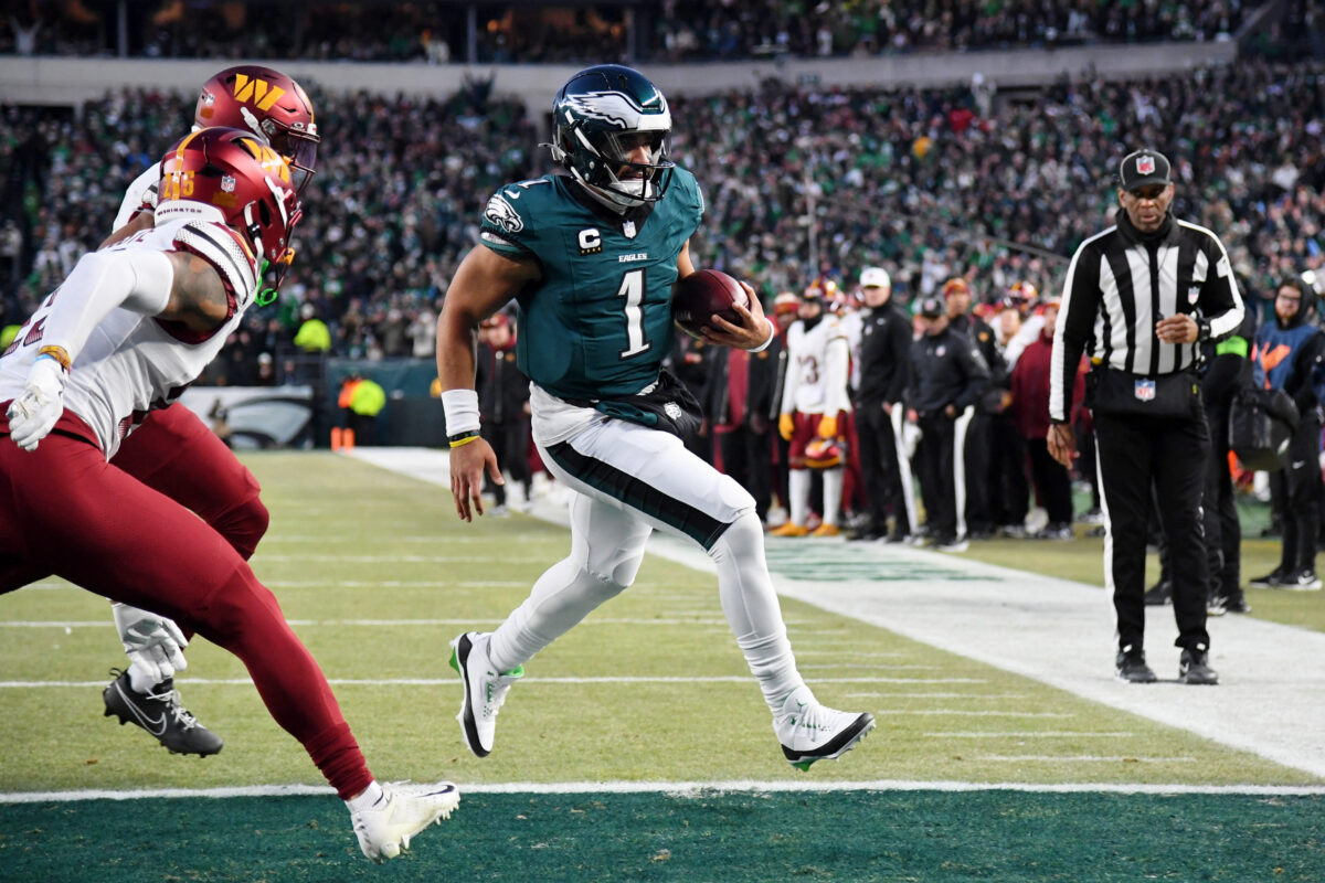 Eagles Commanders Jan 26, 2025; Philadelphia, PA, USA; Philadelphia Eagles quarterback Jalen Hurts (1) runs with the ball for a touchdown against the Washington Commanders during the second half in the NFC Championship game at Lincoln Financial Field. Mandatory Credit: Eric Hartline-Imagn Images