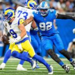 Detroit Lions defensive end Marcus Davenport (92) pressures Los Angeles Rams quarterback Matthew Stafford (9) during the first half at Ford Field in Detroit.