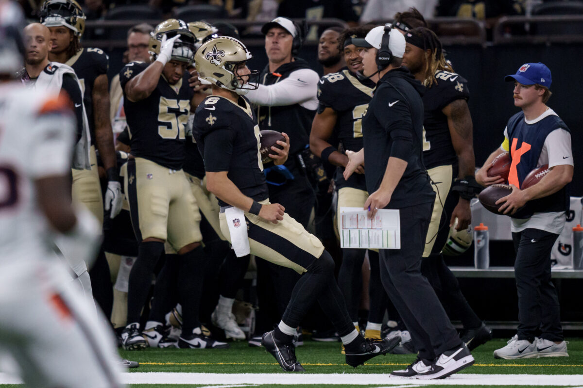 Aug 23, 2025; New Orleans, Louisiana, USA; New Orleans Saints quarterback Tyler Shough (6) runs out of bounds next to New Orleans Saints head coach Kellen Moore against the Denver Broncos during the first half at Caesars Superdome. Mandatory Credit: Matthew Hinton-Imagn Images