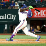 Aug 27, 2025; Arlington, Texas, USA; Texas Rangers right fielder Adolis Garcia (53) hits a three-run home run during the first inning against the Los Angeles Angels at Globe Life Field. Mandatory Credit: Kevin Jairaj-Imagn Images