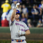 Sep 25, 2025; Chicago, Illinois, USA; New York Mets first base Pete Alonso (20) gestures after hitting a double against the Chicago Cubs during the first inning at Wrigley Field. Mandatory Credit: David Banks-Imagn Images