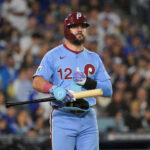Oct 8, 2025; Los Angeles, California, USA; Philadelphia Phillies designated hitter Kyle Schwarber (12) looks on during the seventh inning against the Los Angeles Dodgers during game three of the NLDS round for the 2025 MLB playoffs at Dodger Stadium. Mandatory Credit: Jayne Kamin-Oncea-Imagn Images