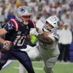 Buffalo Bills defensive tackle Daquan Jones tries to sack New England Patriots quarterback Drake Maye but May was able to get throw the ball for a completion during second half action at Highmark Stadium in Orchard Park on Oct. 5, 2025.