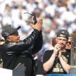 Dodgers manager Dave Roberts acknowledges the crowd during the 2025 World Series championship celebration at Dodger Stadium in Los Angeles on Monday, Nov. 3, 2025.