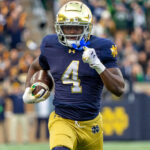 Nov 22, 2025; South Bend, Indiana, USA; Notre Dame Fighting Irish running back Jeremiyah Love (4) runs the ball against the Syracuse Orange during the first half at Notre Dame Stadium. Mandatory Credit: Michael Caterina-Imagn Images