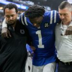 Indianapolis Colts cornerback Sauce Gardner (1) is helped off the field following an injury Sunday, Nov. 30, 2025, during a game against the Houston Texans at Lucas Oil Stadium in Indianapolis.