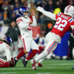 Dec 1, 2025; Foxborough, Massachusetts, USA; New York Giants place kicker Younghoe Koo (37) whiffs on a kick attempt during the second quarter against the New England Patriots at Gillette Stadium. Mandatory Credit: David Butler II-Imagn Images