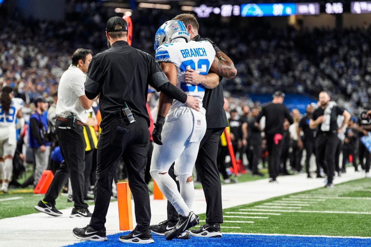 Detroit Lions safety Brian Branch (32) with help of Lions staff, walk off the field due to an injury during the second half against Dallas Cowboys at Ford Field in Detroit on Thursday, Dec. 4, 2025.